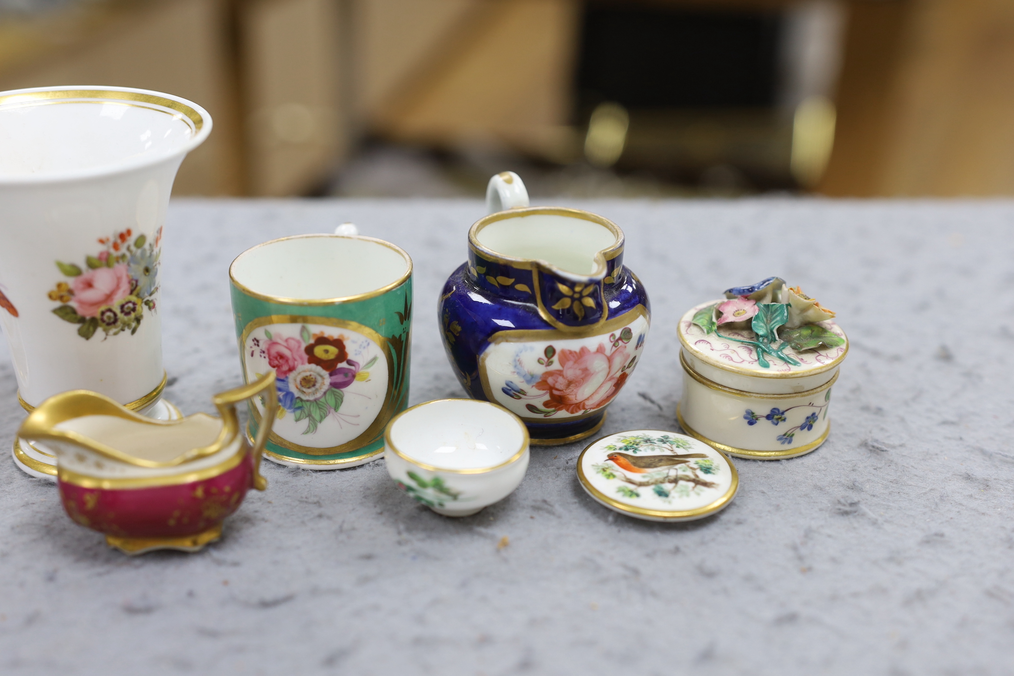 A 19th century Chamberlain Worcester miniature vase painted with flowers, script mark, a miniature jug with painted landscape on a blue ground, probably Chamberlain, an English jug and an English spill vase, an English g
